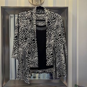 1 piece tank/jacket. Bling on tank and sequins scattered throughout “jacket”